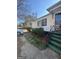 Charming home featuring well-maintained front yard landscaping and black trim around the windows at 1344 Lynford Sw Dr, Atlanta, GA 30310