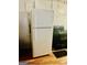 Kitchen features a white refrigerator, black stove, and hardwood flooring at 1344 Lynford Sw Dr, Atlanta, GA 30310