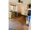 Bright living room featuring wood-look floors, a ceiling fan, and an ornamental fireplace at 1344 Lynford Sw Dr, Atlanta, GA 30310