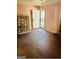 Bright living room features wood-look floors, a ceiling fan, and a view to the entry door at 1344 Lynford Sw Dr, Atlanta, GA 30310