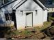 Exterior shot of a small white shed or outbuilding with a door and two small windows at 1344 Lynford Sw Dr, Atlanta, GA 30310
