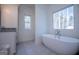 Relaxing bathroom with free-standing bathtub and large window at 16 Edgewater Dr, Temple, GA 30179