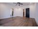 Spacious bedroom with wood-look flooring and an attached bathroom at 16 Edgewater Dr, Temple, GA 30179