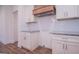 White shaker cabinets and granite countertops in kitchen at 16 Edgewater Dr, Temple, GA 30179