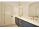 Double vanity bathroom with dark blue cabinets and gold fixtures at 1947 Clark Dr, Tucker, GA 30084