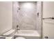 Clean bathroom with a shower/tub combo and updated tile at 1947 Clark Dr, Tucker, GA 30084