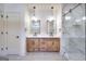 Double vanity bathroom with light wood cabinets and walk-in shower at 1947 Clark Dr, Tucker, GA 30084