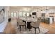 Virtually staged dining room features a glass table and modern chairs at 1947 Clark Dr, Tucker, GA 30084