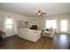 Living room with neutral colored couch, fireplace, and hardwood floors at 316 Trulove Lane Lot 35 # 35, Locust Grove, GA 30248