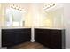 Double vanity bathroom with dark wood cabinets and granite countertops at 5635 Laney Dr # Ln34, Rex, GA 30273