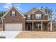 Beautiful two-story brick home with landscaping at 5635 Laney Dr # Ln34, Rex, GA 30273