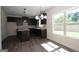 Modern kitchen with dark cabinets, granite countertops, and island at 5635 Laney Dr # Ln34, Rex, GA 30273