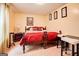 Bedroom with a double bed, wooden furniture, and red bedding at 7101 Brecken Pl, Lithonia, GA 30058