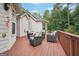 Backyard deck area with stylish patio seating, ideal for outdoor entertainment and relaxation with view of yard at 418 Branch Forest Way, Stockbridge, GA 30281