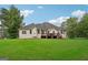 House exterior showcasing a large deck and green space at 418 Branch Forest Way, Stockbridge, GA 30281