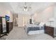 Spacious main bedroom with a ceiling fan and large windows at 418 Branch Forest Way, Stockbridge, GA 30281