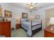 Bright bedroom with double bed, wooden furniture, and lovely wall art at 245 Woodstream Way, Fayetteville, GA 30214