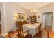 Dining room features hardwood floors, coffered ceiling, and buffet at 245 Woodstream Way, Fayetteville, GA 30214