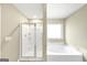 Bathroom with a shower and bathtub at 11945 Lovejoy Crossing Way, Hampton, GA 30228