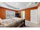Spacious bedroom with large window and neutral wall colors at 11945 Lovejoy Crossing Way, Hampton, GA 30228