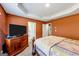 Bright bedroom with a large TV and ample floor space at 11945 Lovejoy Crossing Way, Hampton, GA 30228