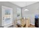 Dining area with table and chairs and access to backyard at 11945 Lovejoy Crossing Way, Hampton, GA 30228