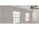 Bedroom with three windows and ceiling fan at 303 Roundwood Way, Peachtree City, GA 30269