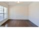 Bright dining room with hardwood floors and wainscoting at 303 Roundwood Way, Peachtree City, GA 30269