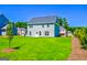 House exterior view showcasing backyard and landscaping at 303 Roundwood Way, Peachtree City, GA 30269