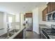 Modern kitchen with stainless steel appliances and granite countertops at 303 Roundwood Way, Peachtree City, GA 30269