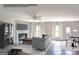 Living room with fireplace and staged furnishings including sofa and chairs at 303 Roundwood Way, Peachtree City, GA 30269