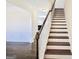 Elegant staircase with dark wood treads and white risers at 303 Roundwood Way, Peachtree City, GA 30269