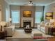 Bright and airy living room with a fireplace and comfortable seating at 556 Paines Nw Ave, Atlanta, GA 30318