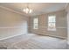 Bright dining room with neutral walls and carpet at 6191 Valley Green Rd, Lithonia, GA 30058