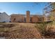 House back view with patio and spacious backyard at 74 Canterbury Dr, Grantville, GA 30220