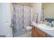 Clean bathroom with single vanity and shower/tub combo at 74 Canterbury Dr, Grantville, GA 30220