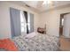 Bedroom with ceiling fan, window, and ensuite bathroom access at 74 Canterbury Dr, Grantville, GA 30220