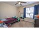 Bedroom with a full-size bed and ceiling fan at 74 Canterbury Dr, Grantville, GA 30220