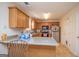 Kitchen with light wood cabinets, granite countertops, and stainless steel appliances at 74 Canterbury Dr, Grantville, GA 30220