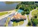 Aerial view of community clubhouse with tennis courts, pool, and lake access at 50 Allie Dr, Mcdonough, GA 30252