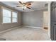 Spacious bedroom with ceiling fan and neutral carpeting at 522 Lake Dr, Hapeville, GA 30354