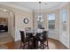 Breakfast nook with glass top table and four chairs at 704 Kitts Ct, Mcdonough, GA 30253