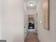 Bright hallway with neutral walls and carpet at 704 Kitts Ct, Mcdonough, GA 30253