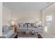 Living room with beige sofa and patterned pillows at 704 Kitts Ct, Mcdonough, GA 30253