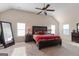 Spacious main bedroom with large bed, ceiling fan, and plenty of natural light at 704 Kitts Ct, Mcdonough, GA 30253