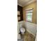 Half bathroom with updated toilet and wainscoting at 430 Lake Dylan Ct, Fairburn, GA 30213