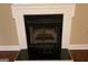 Traditional fireplace with a white mantel and black interior at 430 Lake Dylan Ct, Fairburn, GA 30213