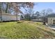 Sloped backyard with shed, stone path and green space at 3213 Woodlynne Way, Atlanta, GA 30340