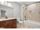 Bathroom with beige tile, a large bathtub, and a modern vanity at 3213 Woodlynne Way, Atlanta, GA 30340