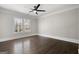 Spacious bedroom with hardwood floors, ceiling fan, and large window at 3213 Woodlynne Way, Atlanta, GA 30340